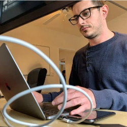 Peter Souza working at laptop computer